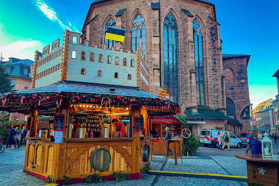 Heidelberg Christmas Market in front of the Catherdal. Image of a Gluhwein Stall. 